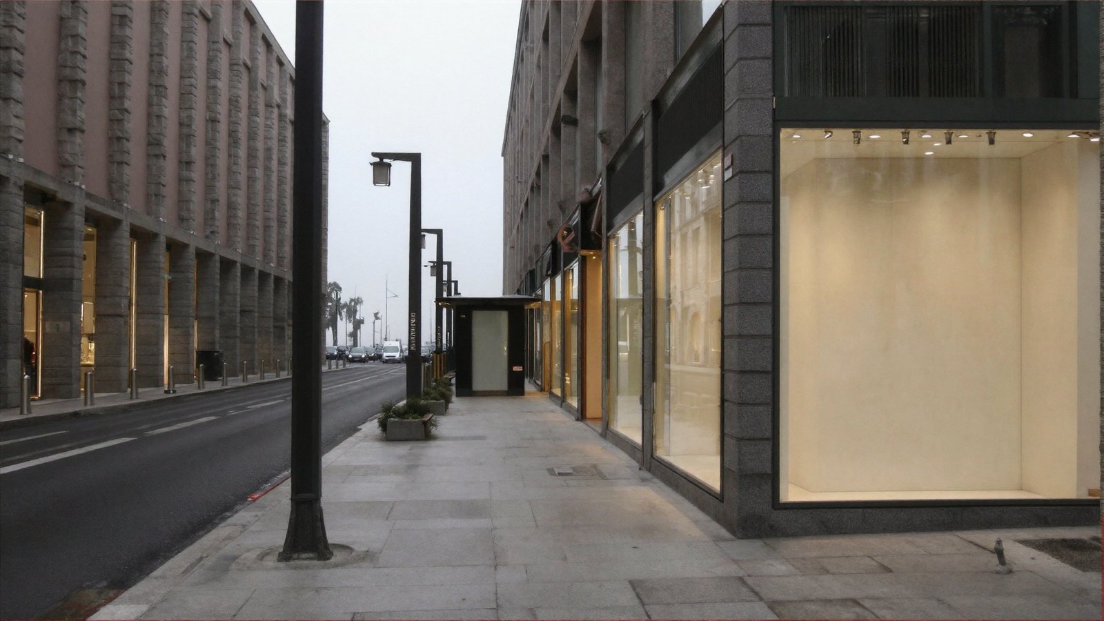 The same street with the far end now open to a soft overcast sky, with the street continuing away past the buildings