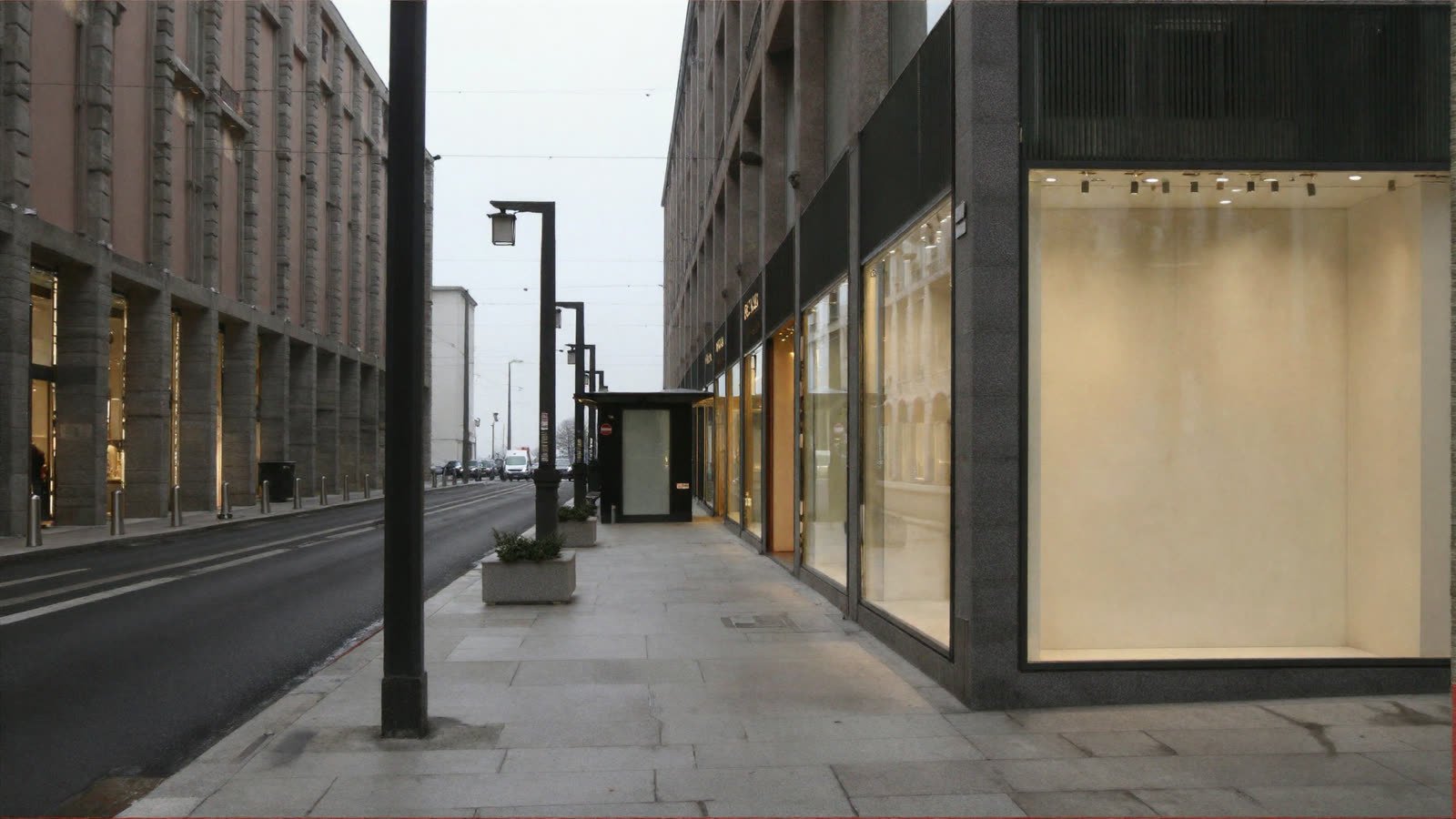 The reverse view looking south: the same arcade of piers now on the left, shopfronts on the right, and the same kiosk seen from behind