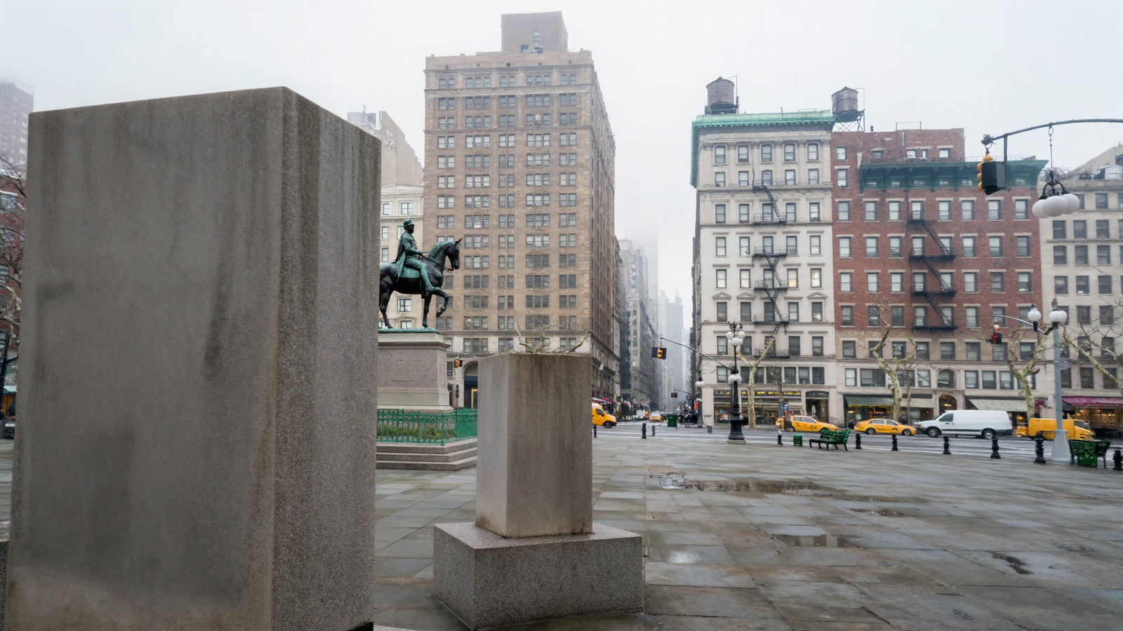 A photorealistic overcast view across Union Square from its east side looking west: the same bronze equestrian statue seen from a different angle on its granite plinth with green railings, pre-war buildings with fire escapes, copper cornices and rooftop water tanks, yellow taxis and a white van on the wet roadway. Two large blank stone blocks stand in the foreground.